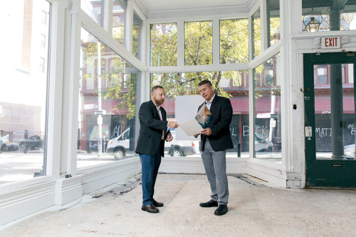 SEEKING TENANTS: Daniel Feiner, left, and Michael Volpe are vice presidents at MG Commercial Real Estate Services Inc. and brokers for the vacant storefronts at 183-185 Mathewson St. in Providence, pictured, which are ready for tenants. / PBN PHOTO/RUPERT WHITELEY