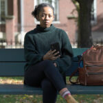 STAYING ALERT: Harvard University graduate student Maya James received an email from a political action committee that seemed harmless: if you support Joe Biden, it urged, click here to check if you’re registered to vote. A little research indicated that it was a phishing scam.  / AP PHOTO/ MICHAEL DWYER