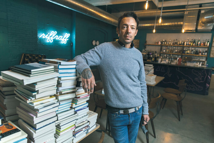 TURNING THE PAGE: Tom Roberge, co-owner of Riffraff Bookstore + Bar, is hopeful that online book sales will increase when and if the business’s outdoor patio, now open daily with limited hours, closes in the winter. / PBN PHOTO/RUPERT WHITELEY
