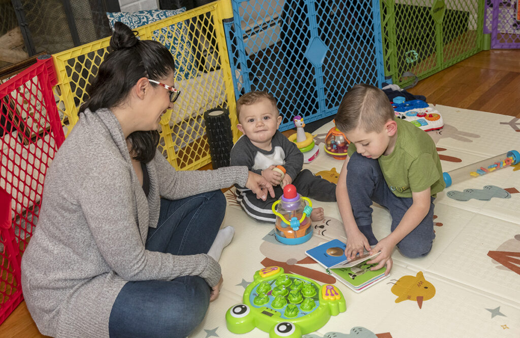 SIDELINED: Jill Boni’s job as a preschool director fit well with her responsibilities as a mother. Her workday ended the same time as day care for her youngest two sons, Angelo, 5, and Gino, 10 months. Now that her preschool closed, she hasn’t found a job with the right hours. / PBN PHOTO/ MICHAEL SALERNO 