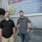 REST ASSURED: Jake Murray, left owner of RI Home Security LLC, with lead technician Hunter Murray. / PBN PHOTO/MICHAEL SALERNO
