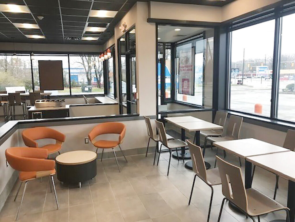 LIGHT AND AIRY: The interior has been spruced up with new furniture that has a contemporary feel. There’s also fresh paint on the walls and a revamped ceiling. / COURTESY OF DUNKIN’