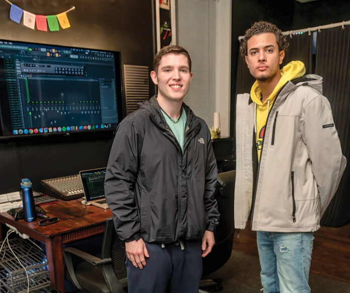 COMMUNITY COLLABORATION: Producer Connor Finelli, left, and hip-hop artist DaLaun Andrade, both recent high school graduates, opened Blue Wave Poetics, a recording studio for local independent artists, in June. / PBN PHOTO/MICHAEL SALERNO