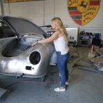 BACK ON THE JOB: Laurina Esposito, co-owner of Espo Restoration, inspects a car frame at her Los Angeles shop. Esposito and her business partner were diagnosed with coronavirus in early September. / AP PHOTO/ MARCIO JOSE SANCHEZ