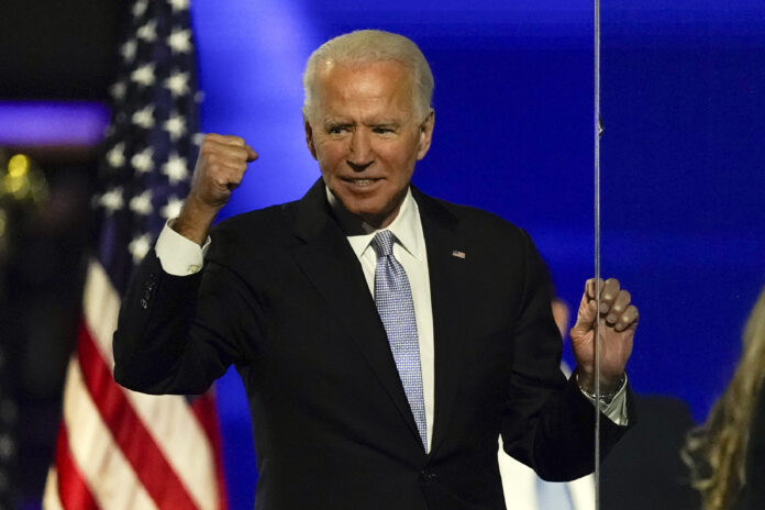 PRESIDENT-ELECT Joe Biden gestures to supporters Saturday. / AP FILE PHOTO/ANDREW HARNIK