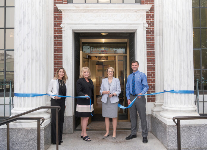 FRESH LOOK: BankNewport administrators cut the ribbon on the recently restored branch in Newport’s Washington Square. Pictured, from left, are Amy Riccitelli, senior vice president and director of retail sales; Mary Leach, executive vice president and director of consumer relationships; Sandra J. Pattie, CEO and president; and Evan Rose, vice president and branch sales manager. / COURTESY BANKNEWPORT