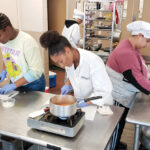 THE RIGHT INGREDIENTS: William M. Davies Jr. Career & Technical High School students, from left, Miracle Dunn, Aiden Nivar-Julius, Dorothy Tavares and Madyisen DaGraca sharpen their cooking skills in a culinary class.  / COURTESY WILLIAM M. DAVIES JR. CAREER & TECHNICAL HIGH SCHOOL