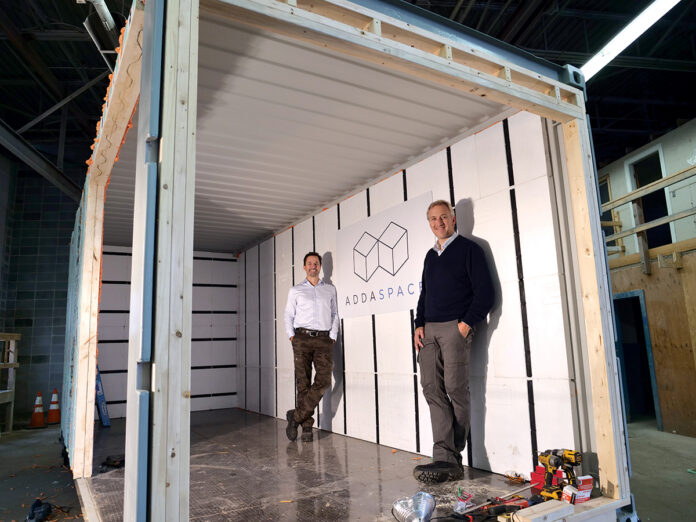 ACCESSORY UNIT: ADDASPACE co-founders Anders Hansen, right, and Andrew Naperotic stand inside of a module that is currently being customized in Bristol. / COURTESY ADDASPACE LLC