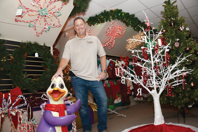 DECORATIONS IN DEMAND: While those hard-hit by the COVID-19 pandemic may be scaling back their holiday displays this year, Chris Beneduce, owner of Impressions Holiday Lighting and Decor in Warwick, says many people have expressed continued interest in decorating this season. / PBN PHOTO/ELIZABETH GRAHAM