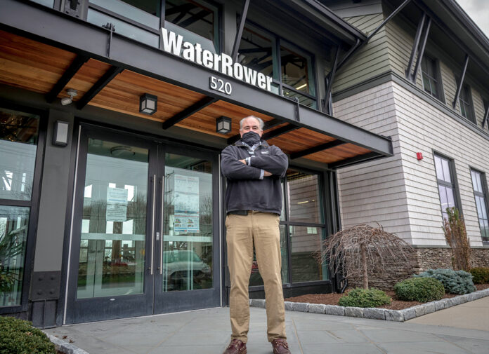 PLAYING IT SAFE: Peter King, CEO and president of WaterRower Inc., says the company has been meticulous about safety measures after a COVID-19 outbreak in the spring. / PBN PHOTO/MICHAEL SALERNO PLAYING IT SAFE: Peter King, CEO and president of WaterRower Inc., says the company has been meticulous about safety measures after a COVID-19 outbreak in the spring. / PBN PHOTO/MICHAEL SALERNO