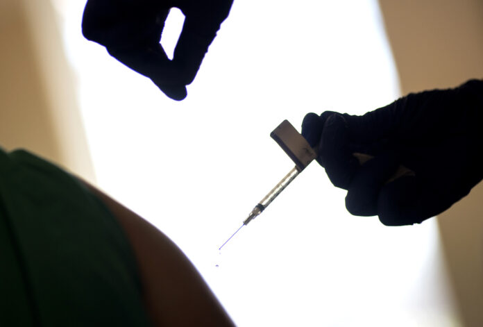 APTOPIX Virus Outbreak Vaccine Rhode Island