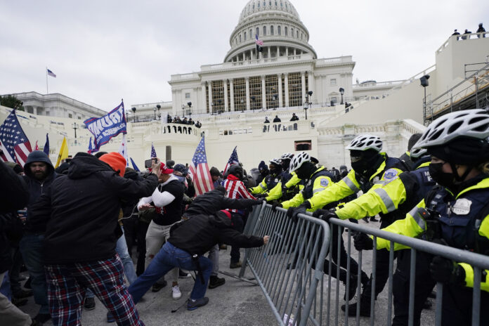 DOZENS OF PEOPLE have breached security perimeters at the U.S. Capitol. / AP FILE PHOTO/JULIO CORTEZ