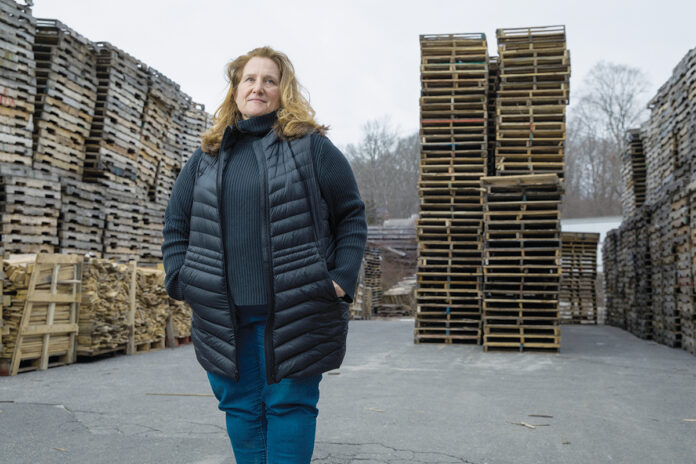 INTEGRAL ROLE: Heather Handrigan-Ross, third-generation owner of Atlas Pallet Corp. in Burrillville, says the manufacturer understood with the onset of COVID-19 “that if people wanted to get masks, wanted to get consumer goods, pallet supply lines would have to flow.”  / PBN PHOTO/RUPERT WHITELEY