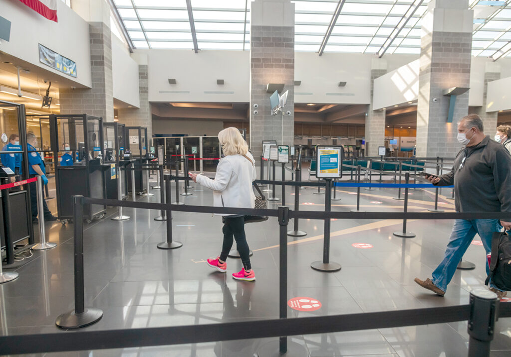 THIN LINE: The security checkpoint at T.F. Green Airport in Warwick has been quieter during the corona­virus pandemic, as passenger traffic has dropped substantially after flights were pulled by major carriers and travel restrictions were implemented in an effort to slow the spread of the virus. / PBN PHOTO/MICHAEL SALERNO