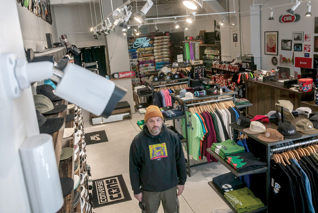 WATCHFUL EYE: Guido Silvestri is the owner of Civil, a skateboard shop with a downtown Providence location that was heavily damaged during a riot on June 2, 2020, forcing him to close the store for several weeks and make several thousand dollars’ worth of upgrades to his security system, including cameras and a TV. / PBN PHOTO/MICHAEL SALERNO