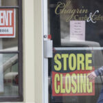 U.S. jobless claims fall to 712,000 as pace of layoffs eases