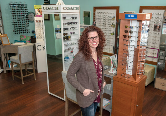 STAYING SHARP: Lori Duquette, owner of Duquette Family Eye Care Inc., says her upbringing in a large family taught her skills that have helped her run her own ­business. / PBN PHOTO/MICHAEL SALERNO