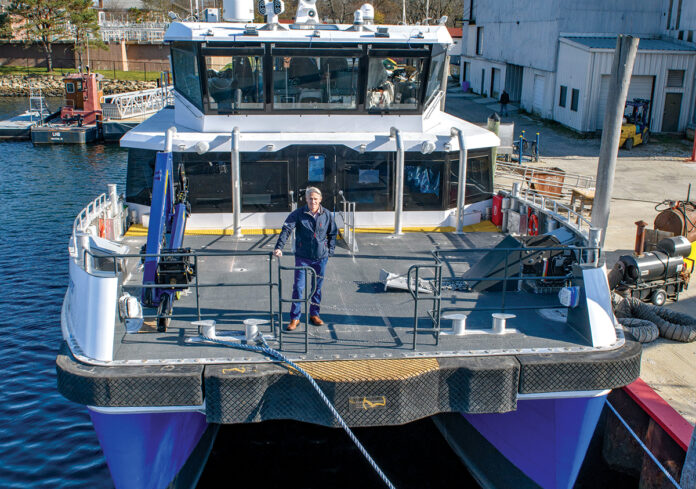 DOCKED: Charlie Donadio Jr., founder, CEO and president of Atlantic Wind Transfers, stands on board the Atlantic Pioneer, one of two vessels his company uses to transport technicians and equipment to offshore wind turbines for repairs and maintenance.  / COURTESY ATLANTIC WIND TRANSFERS