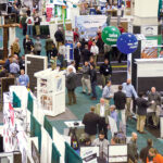 ATTENDEES AND EXHIBITORS interact at a past Northeastern Retail Lumber Association expo hall at the R.I. Convention Center in Providence. Gov. Daniel J. McKee announced Thursday that the convention center, which has been closed since March 2020 due to the COVID-19 pandemic, is slated to reopen in August. / COURTESY NORTHEASTERN RETAIL LUMBER ASSOCIATION