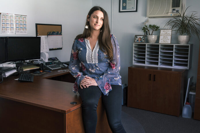 SELF-STARTER: Haley Lattinville, personnel manager for the town of North Kingstown, which lacks a human resources department, took it upon herself to learn various HR tasks and responsibilities, which allowed her to guide the town through the COVID-19 pandemic. / PBN PHOTO/RUPERT WHITELEY
