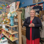SERVICE-MINDED: Nicole O’Brien, pictured above, is owner of the artisan boutique Operation Made in Warwick that features handmade items created by veterans and their families, including flowers made of wood by veteran Jazmine Jackson, a Cranston native and Army National Guard veteran. / PBN PHOTO/MICHAEL SALERNO