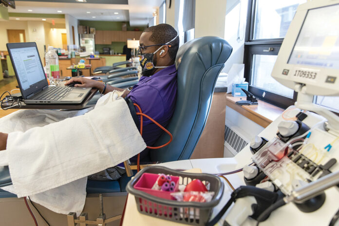 IN NEED: Andre Gill donates blood at the Rhode Island Blood Center. The center says donations are decreasing as people become more active as the economy reopens and COVID-19 infections decline. / PBN PHOTO/RUPERT WHITELEY IN NEED: Andre Gill donates blood at the Rhode Island Blood Center. The center says donations are decreasing as people become more active as the economy reopens and COVID-19 infections decline. / PBN PHOTO/RUPERT WHITELEY