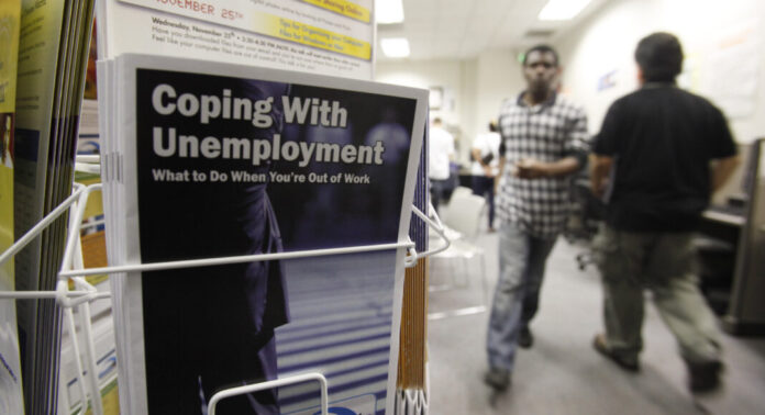 THE NUMBER OF PEOPLE collecting unemployment claim benefits in Rhode Island totaled 67,040 last week. / AP FILE PHOTO/PAUL SAKUMA
