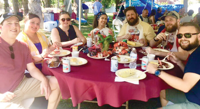 DELICIOUS DAY: AVTECH Software Inc. employees enjoy a meal during a company outing. / COURTESY AVTECH SOFTWARE INC. DELICIOUS DAY: AVTECH Software Inc. employees enjoy a meal during a company outing. / COURTESY AVTECH SOFTWARE INC.