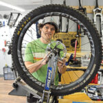 ATTENTION TO DETAIL: Mike Galoob, owner of Mythic Bike Works LLC in South Kingstown, repairs a bike in his shop. / PBN PHOTO/ELIZABETH GRAHAM