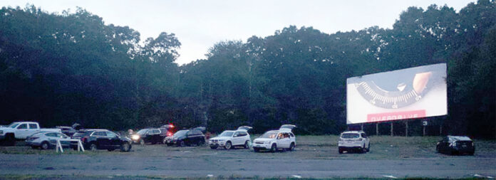 SCREEN TIME: Envision Technology Advisors LLC employees take in a movie at Rustic Drive-In in North Smithfield. / COURTESY ENVISION TECHNOLOGY Advisors LLC