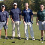 ON THE LINKS: Compass IT Compliance LLC employees compete in the company’s inaugural golf tournament. / COURTESY COMPASS IT COMPLIANCE LLC