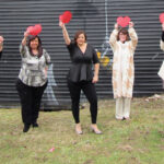 HEARTS OF GOLD: Employees with Carey, Richmond & Viking Insurance hold up paper hearts in support of fighting cardiovascular disease. / COURTESY CAREY, RICHMOND & VIKING INSURANCE