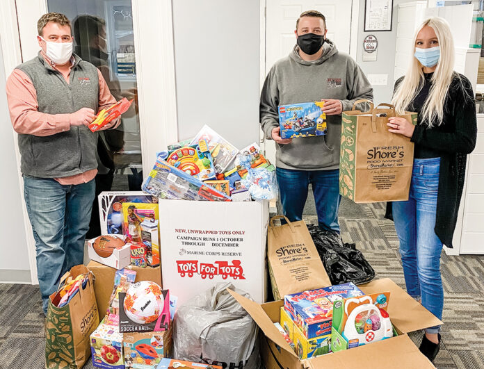 GIFT GIVING: RIKB Design Build team members raise donations for Toys for Tots of Rhode Island during the holiday season. / COURTESY RIKB DESIGN BUILD