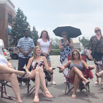 GETTING SOME SUN: CompuClaim Inc. employees relax together and enjoy the sunshine. / COURTESY COMPUCLAIM INC.