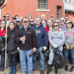 Rhode Island Foundation NICE AND TIDY: Rhode Island Foundation employees and their families perform a community cleanup. / COURTESY RHODE ISLAND FOUNDATION