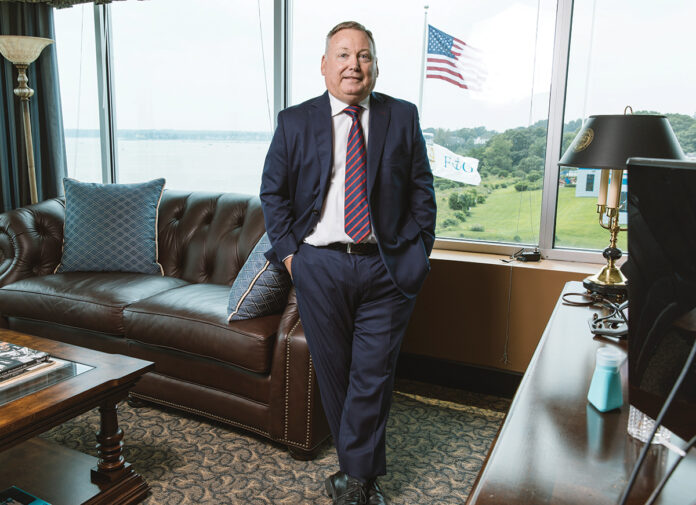 CHARITABLE GIVING: At the onset of the COVID-19 pandemic, Michael Falvey, CEO and president of Falvey Insurance Group in North Kingstown, provided all his employees with $100 and the instructions to use it to benefit someone in need, and a few months later gave all employees $250 to donate to a social justice cause of their choice. / PBN PHOTO/RUPERT WHITELEY CHARITABLE GIVING: At the onset of the COVID-19 pandemic, Michael Falvey, CEO and president of Falvey Insurance Group in North Kingstown, provided all his employees with $100 and the instructions to use it to benefit someone in need, and a few months later gave all employees $250 to donate to a social justice cause of their choice. / PBN PHOTO/RUPERT WHITELEY