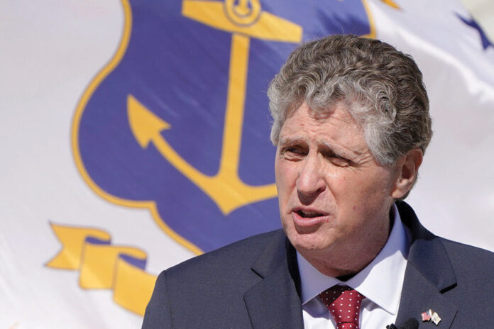 GOV. DANIEL J. MCKEE said Tuesday, Aug. 10, 2021, that Rhode Island will soon require employees at health care facilities to get the COVID-19 vaccine. / AP FILE PHOTO/STEVEN SENNE GOV. DANIEL J. MCKEE said Tuesday, Aug. 10, 2021, that Rhode Island will soon require employees at health care facilities to get the COVID-19 vaccine. / AP FILE PHOTO/STEVEN SENNE