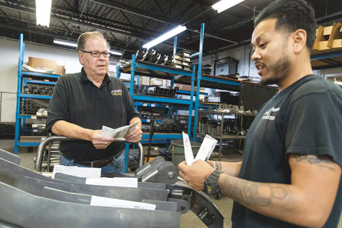 EXPANSION PLANS: Gerald Carlson, left, owner of Auto Rust Technicians in Cranston, recently spent $500,000 to expand operations and is considering buying more equipment. He’s pictured with manufacturing manager Karr Thang. / PBN FILE PHOTO/RUPERT WHITELEY EXPANSION PLANS: Gerald Carlson, left, owner of Auto Rust Technicians in Cranston, recently spent $500,000 to expand operations and is considering buying more equipment. He’s pictured with manufacturing manager Karr Thang. / PBN FILE PHOTO/RUPERT WHITELEY