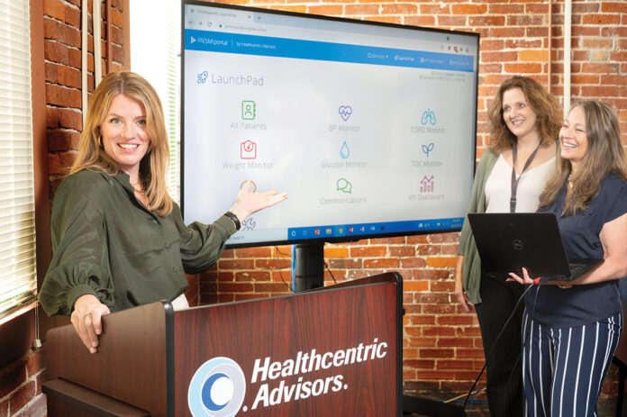 WALKTHROUGH: Lauren Capizzo, left, director of digital solutions and practice transformation at medical technology company Healthcentric Advisors Inc. in Providence, walks through the company’s PRiSM platform, with colleagues Melissa Miranda, center, senior project program administrator; and Brenda Jenkins, senior program administrator. / PBN PHOTO/DAVE HANSEN WALKTHROUGH: Lauren Capizzo, left, director of digital solutions and practice transformation at medical technology company Healthcentric Advisors Inc. in Providence, walks through the company’s PRiSM platform, with colleagues Melissa Miranda, center, senior project program administrator; and Brenda Jenkins, senior program administrator. / PBN PHOTO/DAVE HANSEN