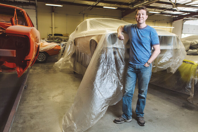 SERIOUS WORK: For Michael Mancini, owner of American Muscle Car Restorations in North Kingstown, pictured here in 2018, restoring cars began as a family hobby that has turned into a full-time career. / PBN FILE PHOTO/RUPERT WHITELEY