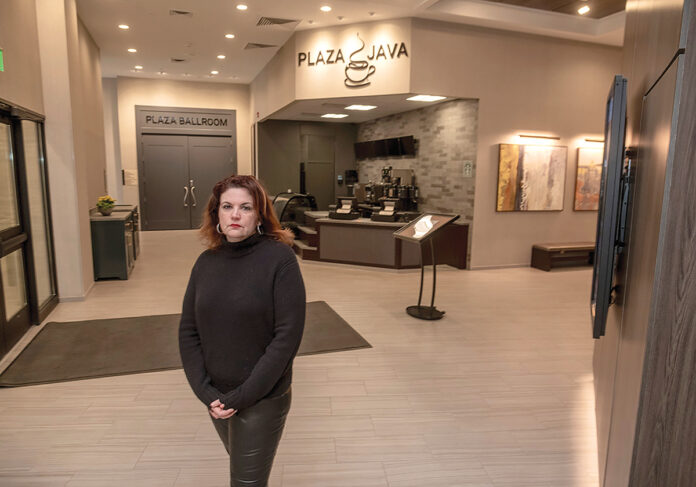EMPTY FEELING: Kristen Adamo, CEO and president of the Providence Warwick Convention & Visitors Bureau, stands in the barren lobby at the Crown Plaza Providence-Warwick in Warwick in March 2020, after the COVID-19 pandemic caused a massive amount of canceled trips. / PBN FILE PHOTO/MICHAEL SALERNO