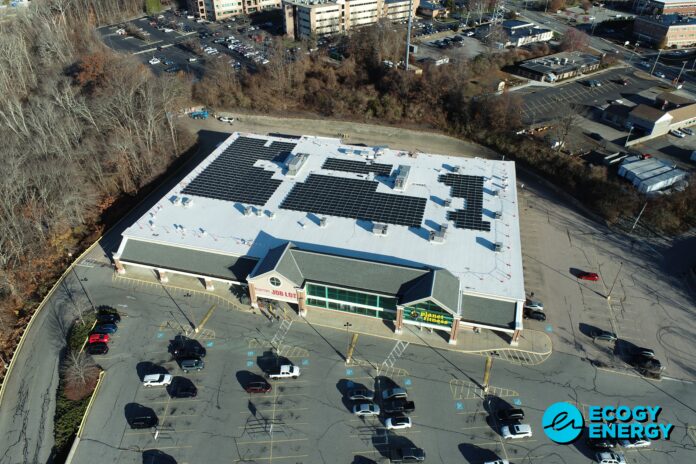 OCEAN STATE JOB LOT has teamed up with Newport solar developer Ecogy Energy to add solar arrays at 10 Rhode Island stores, creating the state's largest rooftop solar portfolio through National Grid's Renewable Energy Growth Program. Pictured is the first set of panels on its Johnston store, where work began a few weeks ago. / COURTESY ECOGY ENERGY