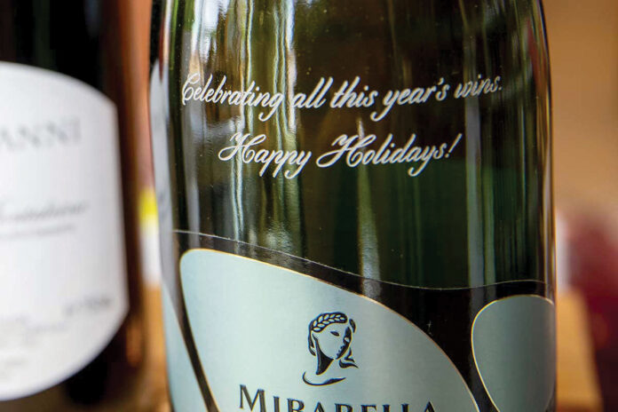 MESSAGE ON A BOTTLE: An engraved bottle is one of several gift ideas involving wine and spirits.  / COURTESY JESSICA NORRIS GRANATIERO