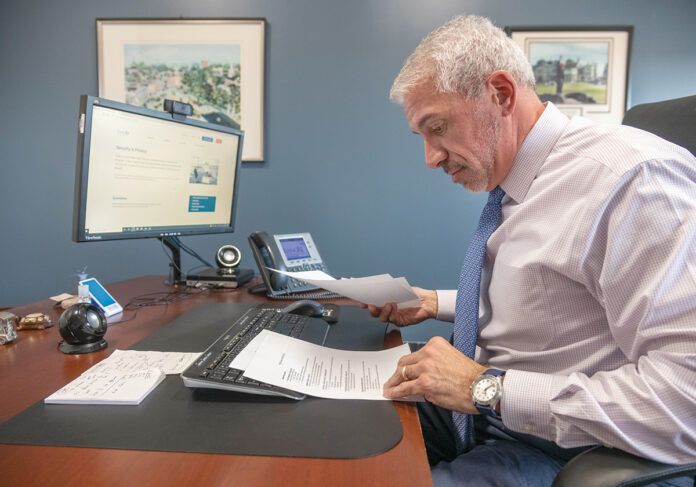 FEELING WARY: Steven M. Parente, executive vice president and director of retail banking for Bank Rhode Island, says the bank has taken steps to prevent scammers from tricking customers who use a peer-to-peer payment platform. / PBN PHOTO/MICHAEL SALERNO