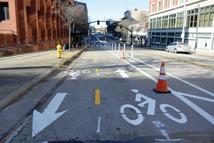 MUTED REACTION: Reaction to sections of new bike lanes on Empire Street in downtown Providence, pictured, has been muted, at least so far, unlike other areas of the city such as along South Water Street.  / PBN PHOTO/ELIZABETH GRAHAM