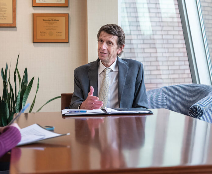 REACHING OUT: Bryant University President Ross Gittell says since three-fourths of the school’s students come from Rhode Island, Massachusetts and Connecticut, Bryant is increasing its efforts to enhance knowledge about the university beyond the New England region. / PBN PHOTO/MICHAEL SALERNO 