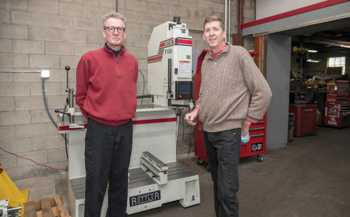 FOCUS SHIFT: Stephen Clair, left, and Brad Clair, brothers and co-owners of Simplex Engine & Repair Co. in Providence, a third-generation, family-owned machine and engine parts company, say auto dealers were once a major part of the company’s client base, but the focus has shifted to heavy-duty construction companies. / PBN PHOTO/MICHAEL SALERNO