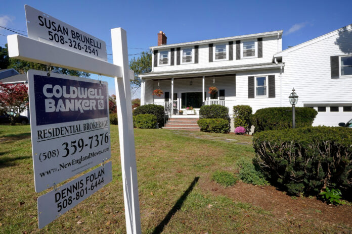 THE MEDIAN price of single-family homes sold in Rhode Island climbed in January by 10.8 % from a year ago, while sales increased after falling in the last six months of 2021, the Rhode Island Association of Realtors said Thursday. / AP FILE PHOTO/STEVEN SENNE