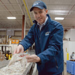 SQUID MASTER: Ryan G. Clark, CEO and president of The Town Dock in Narragansett, took the reins of the family-owned wholesale squid supplier in 2016 and in recent years has been overseeing the launch of the company’s own calamari brand. / PBN PHOTO/ELIZABETH GRAHAM