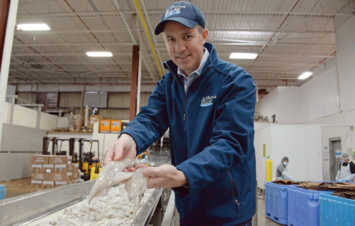 SQUID MASTER: Ryan G. Clark, CEO and president of The Town Dock in Narragansett, took the reins of the family-owned wholesale squid supplier in 2016 and in recent years has been overseeing the launch of the company’s own calamari brand. / PBN PHOTO/ELIZABETH GRAHAM